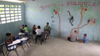 Rachel Teter and other volunteers painting a mural at the community library, El Plátano, Panama 