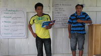 Alternate view of two male participants addressing the group at an agribusiness seminar in Bocas del Toro, Panama 
