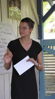Alternate view of a female Peace Corps Volunteer addressing the group at an agribusiness seminar in Bocas del Toro, Panama