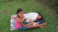 Amarilis and sister lounging in the grass, El Plátano, Panama 