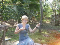 Rachel Teter holds a boa constrictor in El Plátano, Panama 