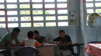 Boys playing a card game in the newly opened library, El Plátano, Panama 