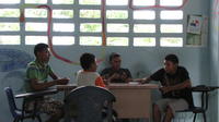 Boys play card together in the community library, El Plátano, Panama 