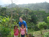 A friend poses with Rachel Teter's neighbor's children, El Plátano, Panama