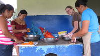 Rachel Teter poses while helping local women prepare food for her farewell party, El Plátano, Panama 