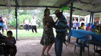 Rachel Teter dances with a man at her farewell party, El Plátano, Panama 