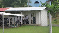 School children gather outside the library in El Plátano, Panama