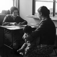 Peace Corps Volunteer nurse Kate Lorig consults a mother regarding her child at the Consultorio Gil de Castro, Valdivia, Chile