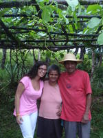 Woman poses with couple in El Barrigón, Panama