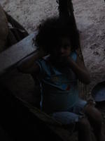 Girl poses in a swing, El Barrigón, Panama