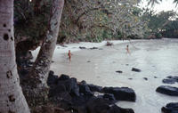 Makerita and Tupu running on the beach near fale (thatched hut), Manono, Samoa, circa 1974-1977