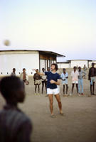 Peace Corp Volunteer Paul Stoler teaching volleyball to high school students