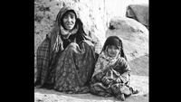 A Woman and Child Wait for Food and Medical Supplies on the Darzak Plains of the Hindu Kush, Afghanistan, c. 1971-1973