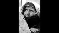 An Elderly Woman Waits for Food and Medical Supplies on the Darzak Plains of the Hindu Kush, Afghanistan, c. 1971-1973