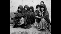 A Woman and Her Children Wait for Winter Supplies on the Darzak Plains of Afghanistan, c. 1971-1973