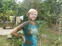 Rachel Teter covered in mud after carrying sand from the river, El Plátano, Panama