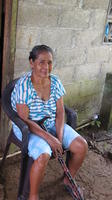 Abuela Chiru sitting in a chair with walking cane in El Plátano, Panama 