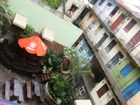 Aerial view of apartment building and patio seating in the Casco Viejo district of Panama City, Panama