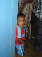 Boy poses for a picture before his birthday party, El Plátano, Panama