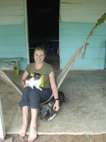 Rachel Teter sits with a dog and cat, El Plátano, Panama