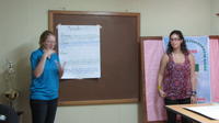Close-up of Rachel Teter and another volunteer at the final agribusiness seminar, Panama