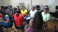 Men and women working in groups at the final agribusiness seminar in Panama 