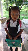 Young girl dressed for her first day of school, El Plátano, Panama