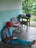 Jason sits on Rachel Teter's porch, El Plátano, Panama