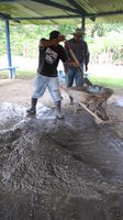Men mixing cement at the library construction site, El Plátano, Panama