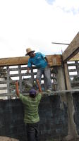 Men work with cement at the library construction site, El Plátano, Panama