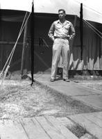 First Lt. Herbert Striner in front of a tent, Camp Kanchrapara (Winter 1946)