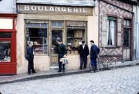 Dr. Ellis Johnson in front of a bakery in Chagny, France (September, 1960)