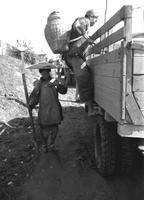 Chinese man and woman with a truck, Burma Road, Yunnan Province, Southern China (September 1945)