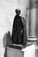 Bronze statue of Abraham Lincoln kneeling at the Washington National Cathedral (1977)