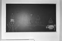 Blackboard demonstrating print and cursive writing