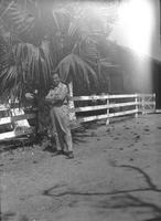 First Lt. Myers in front of a palm tree, Camp Kanchrapara (Winter 1946) (2)