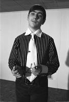Alternate view of Richard Striner posing wearing a striped shirt and polka dot tie