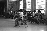 Children clapping during a music lesson at the Potomac School as part of the Adams-Morgan Community Council's Potomac Summer Project, McLean, Virginia