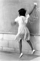 Alternate view of a girl erasing chalkboard at the Potomac School as part of the Adams-Morgan Community Council's Potomac Summer Project, McLean, Virginia
