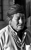 Alternate view of a Navajo man wearing necklace at trading post, Chinle, Arizona