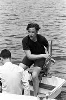 Young man and Richard Striner in a motor boat on Chesapeake Bay, Maryland
