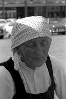 Portrait of an elderly woman wearing a white head scarf