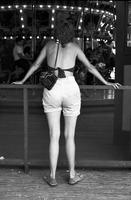Woman watching the Dentzel Carousel at Glen Echo Park, Glen Echo, Maryland