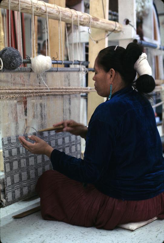 Navajo woman weaving a rug on a loom, Navajo Reservation, Arizona (1966)