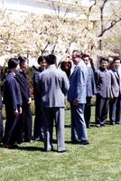 President Richard Nixon standing with members of the Chinese table tennis team on the White House lawn in Washington, D.C.