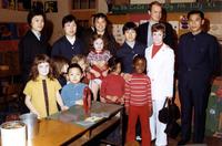 Female members of Chinese table tennis team posing with students from P.S. 75 in New York City