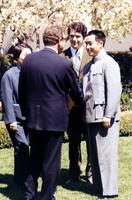 Henry Kissinger greeting members of Chinese delegation on White House lawn in Washington, D.C.