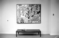 Alternate view of large painting hanging over wooden bench