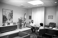 Alternate view of a meeting between man and woman in an office inside the Embassy of Israel, Washington, D.C.