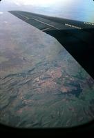Aerial landscape photograph taken from an airplane window